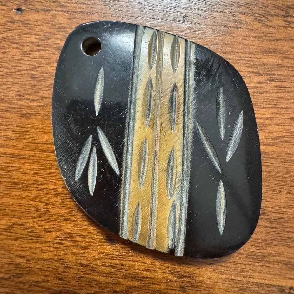 Black and Tan Carved Pendant